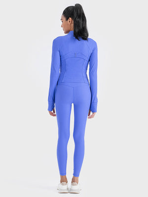 Ribbed performance zip-up jacket in Cobalt Blue with thumbholes and contoured seams.