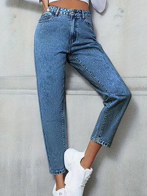 Medium wash high-rise denim jeans with a relaxed fit and button fly.