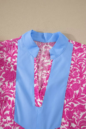 Vibrant floral midi dress with pink flowers and blue collar detail.