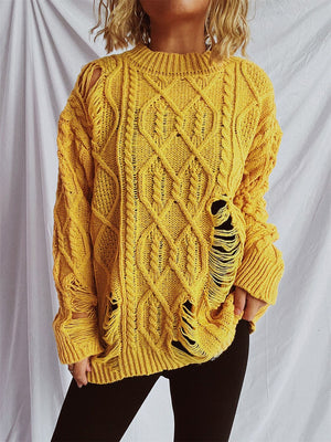 Yellow distressed cable knit sweater with ripped details and crew neckline.