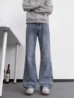 Blue wide-leg jeans with star embroidery detail on the hem.