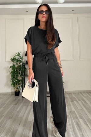Black relaxed fit tee and wide leg pants set with drawstring waist.