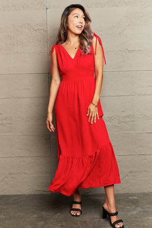 Red polyester midi dress with tie straps, empire waist, and ruffle hem