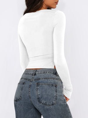 White long sleeve ruched top with adjustable side tie detail