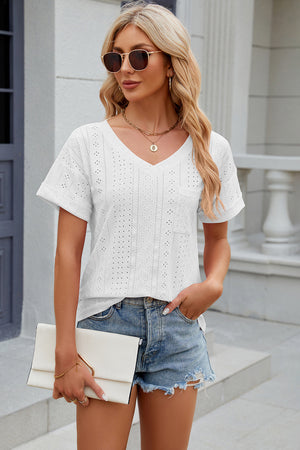 White perforated v-neck t-shirt with rolled sleeves and a chest pocket.
