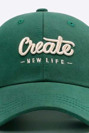 Green baseball cap with embroidered "Create New Life" text