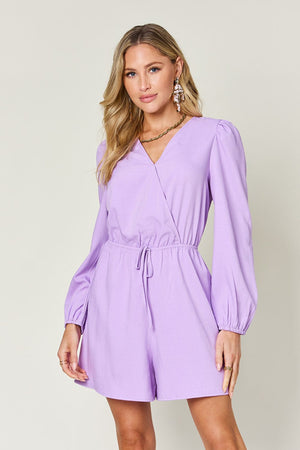 Lavender wrap front romper with puff sleeves and adjustable drawstring waist