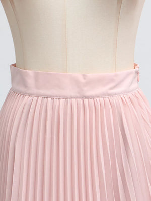 Pink pleated skirt suit with a frill collar detail and balloon sleeves.
