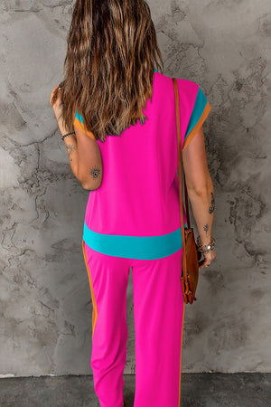 Colorblock activewear set with contrast trim in hot pink, teal, and orange.