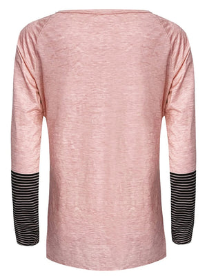 Dusty pink raglan tee with striped cuffs and a rounded neckline.