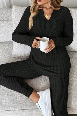 Black ribbed loungewear set with notched V-neck long sleeve top and matching pants.