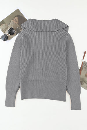 Gray ribbed knit cardigan with a shawl collar and cuffed sleeves.