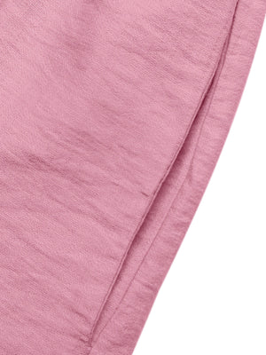 Pink maternity wrap romper with a textured fabric detail.