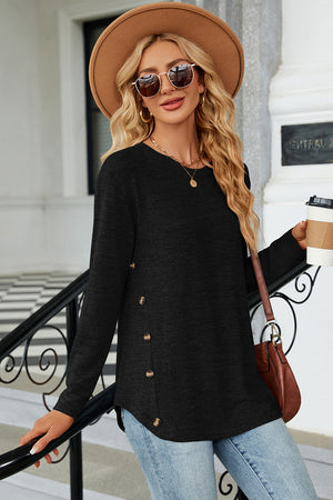 Black long sleeve top with side buttons and slit hem detail