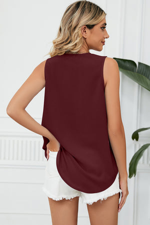 Burgundy V-neck tank top with lace trim and curved hem