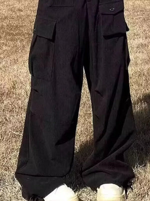 Black ribbed cargo joggers with spacious pockets and button closures.
