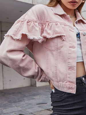 Blush pink denim trucker jacket with frayed ruffle detail across the chest and sleeves.