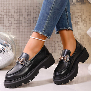 Chunky lug sole loafers in gloss black with gold chain detail and thick platform sole.