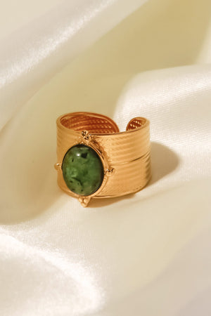 Textured cuff ring with green stone and gold band