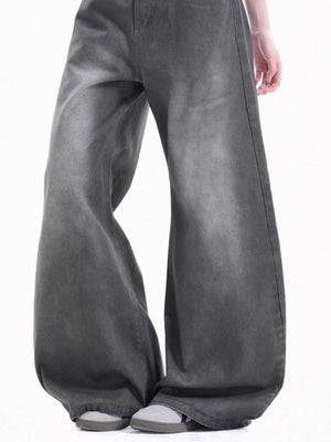 Men's relaxed fit wide-leg jeans in faded grey cotton with a washed denim look.