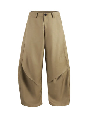 Relaxed fit men's sweatpants in deep khaki with wide legs and unique paneling.