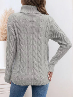 Grey cable-knit turtleneck sweater with ribbed cuffs and hem.