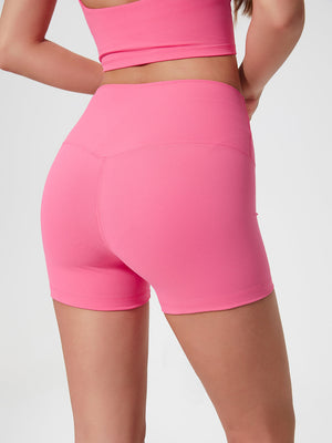 Nova Rise High-Motion Shorts in Fuchsia Pink, showing v-seam detail and high waist.