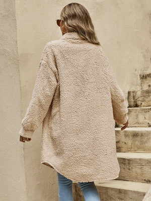 Oversized teddy bear shacket in camel with button-down front and long sleeves.
