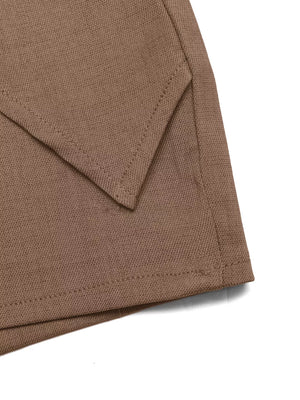 Brown twist-front skort with decorative button detail and angled hem.