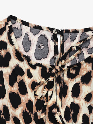 Leopard print jumpsuit with tie-neck detail and puff sleeves