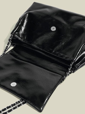 Black crinkled pu leather shoulder bag with chain strap and snap closure detail