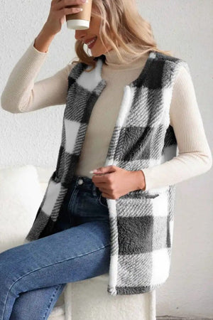 Oversized buffalo check sherpa gilet in black and white, with a cozy fuzzy texture.