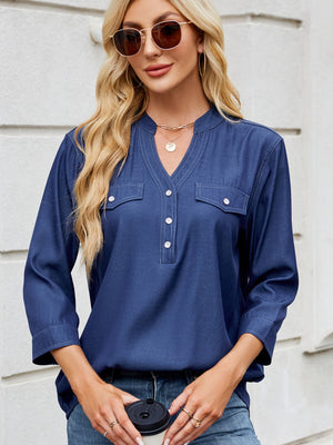 Dark navy denim henley blouse with chest pockets and contrast stitching.