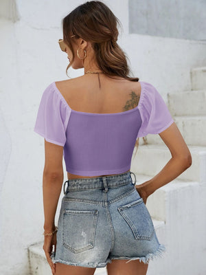 Purple ribbed crop top with sheer chiffon sleeves and square neckline.