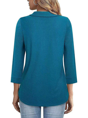 Peacock blue textured polo top with 3/4 sleeves and a collar.