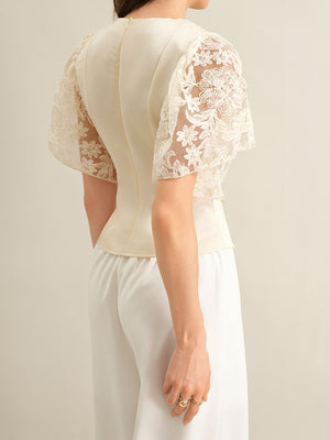 Apricot lace trimmed short sleeve blouse with sheer floral sleeves.