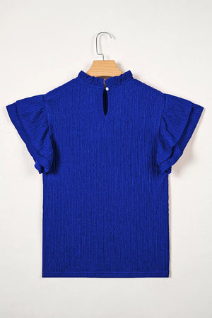 Blue textured short sleeve shirt with ruffle trim and mock neck