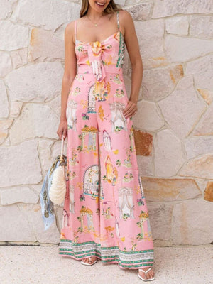 Pink architectural print tie-front wide-leg jumpsuit with bow detail and spaghetti straps.