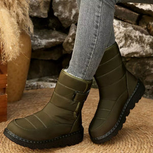 Green quilted round toe platform boots with adjustable strap and chunky sole.