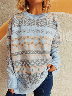 Light blue acrylic Fair Isle knit oversized sweater with crew neck and ribbed cuffs.