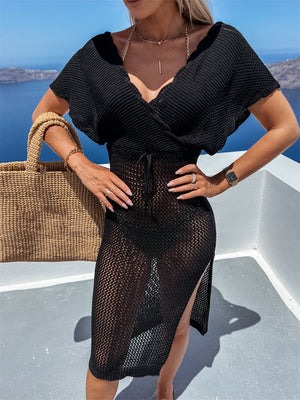 Black knit wrap cover-up with V-neck, short sleeves, drawstring waist, and high slit.
