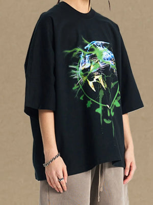 Black oversized tee with electric leopard graphic print and crew neck.