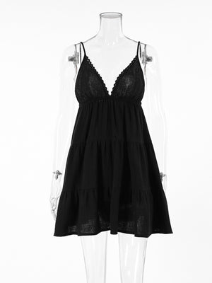 Black cotton tiered mini dress with lace trim V-neck and spaghetti straps