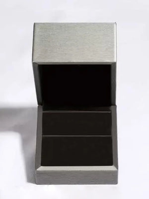 Emerald Prism Silver Ring jewelry box with brushed silver lid and dark interior.