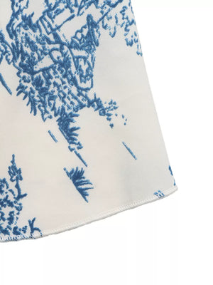 Charming Floral Tie-front Cami Top in blue with a tie-front detail.