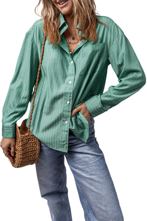 Oversized Sage stripe Oxford shirt with button front and pocket, styled with jeans.