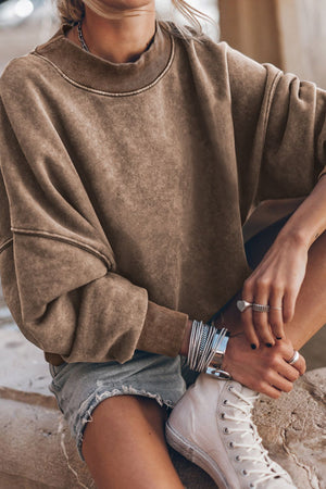 Acid wash taupe mock neck sweatshirt with ribbed cuffs and neckline.