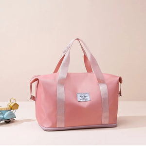 Dusty Pink nylon tote bag with dual handles and a central label.