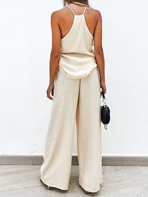Cream pleated palazzo pants and cami set with a relaxed fit.