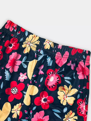 Baby shorts with dark floral print, elastic waistband, and colorful flowers.